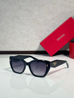 Prada glasses with dark navy frames and dark tinted lenses