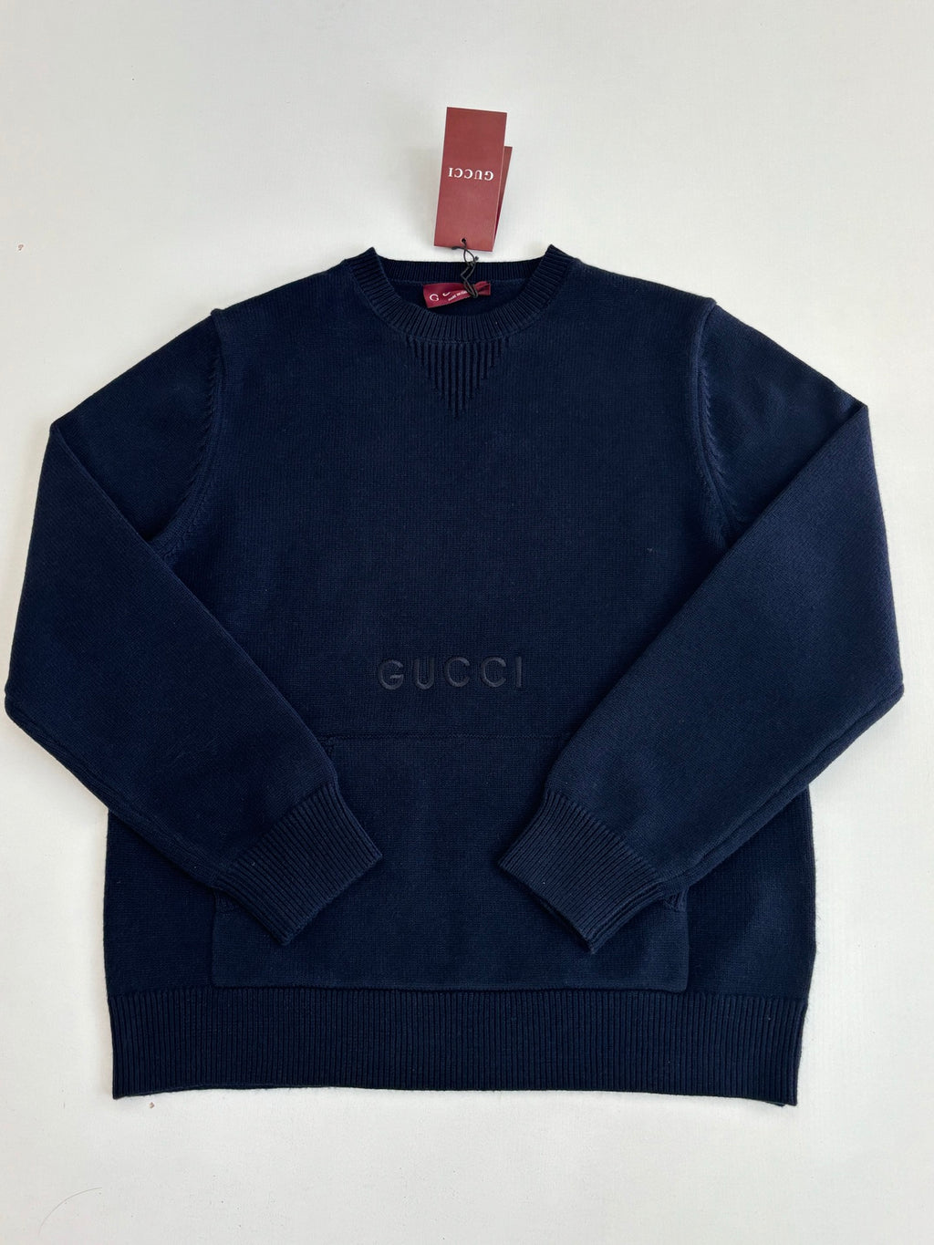 Navy long-sleeve knit pullover sweater with crew neck and Gucci logo near center