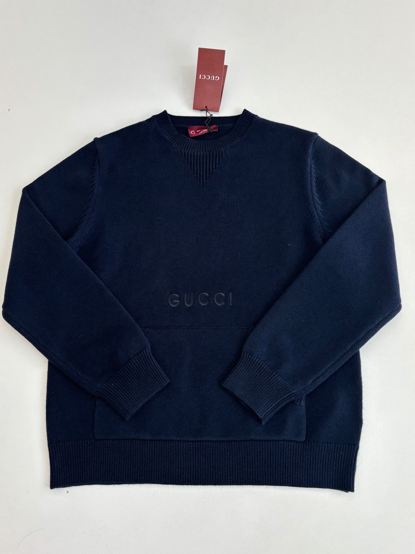 Navy long-sleeve knit pullover sweater with crew neck and Gucci logo near center
