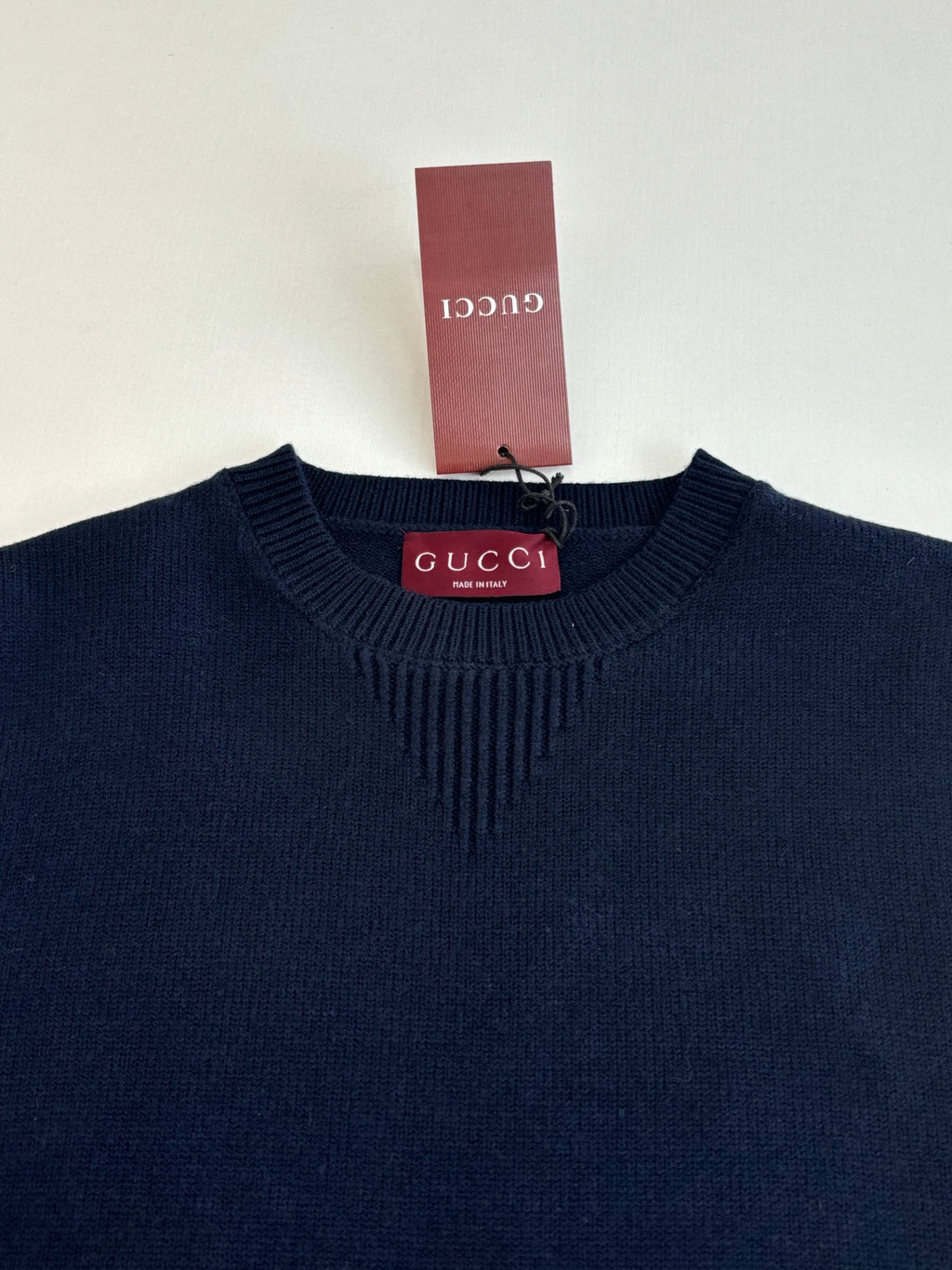 Navy ribbed crew-neck knit sweater with Gucci label at the collar