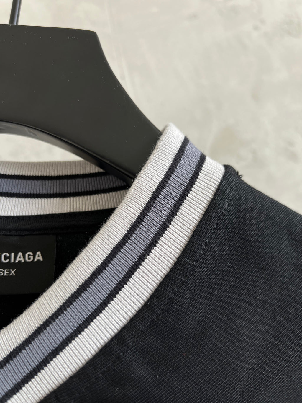 Black T-shirt collar with white and navy striped ribbed trim
