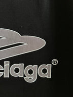 Close-up of black T-shirt chest graphic with embroidered Balenciaga lettering