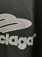 Close-up of black T-shirt chest logo with Balenciaga lettering embroidery