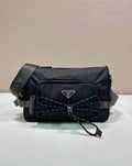 Prada nylon shoulder bag in dark blue with quilted front, logo plaque, strap and chain