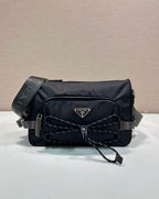 Prada nylon shoulder bag in dark blue with quilted front, logo plaque, strap and chain