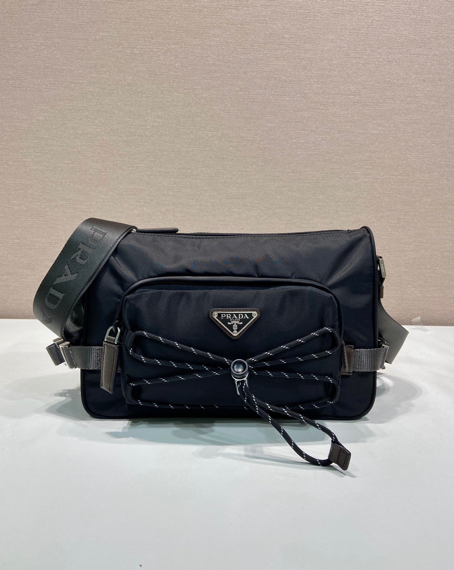 Prada nylon shoulder bag in dark blue with quilted front, logo plaque, strap and chain
