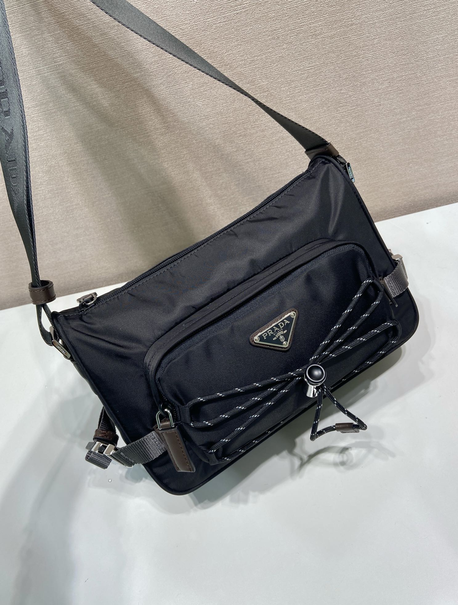 Prada nylon crossbody bag, dark blue, quilted panel, triangular logo, adjustable strap