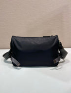 Prada nylon bag in dark blue with smooth back panel and two adjustable shoulder straps