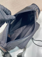 Prada nylon bag interior view with zipped opening and gray lining