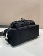 Prada nylon handbag in dark blue with braided top handle and side logo detail