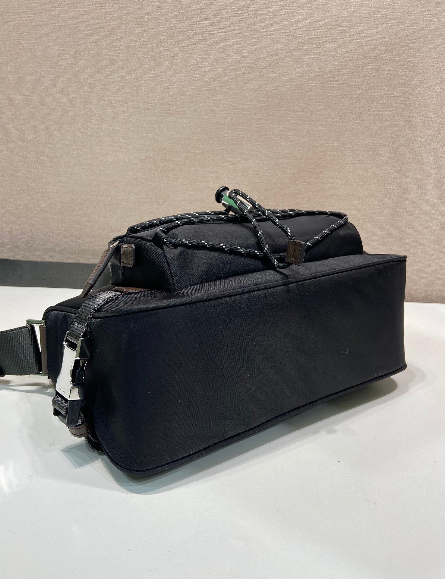 Prada nylon handbag in dark blue with braided top handle and side logo detail