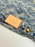 Blue denim jacket with monogram print, tan LV leather patch and gold button