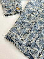Pair of blue monogram-pattern denim pants with front button and belt loops