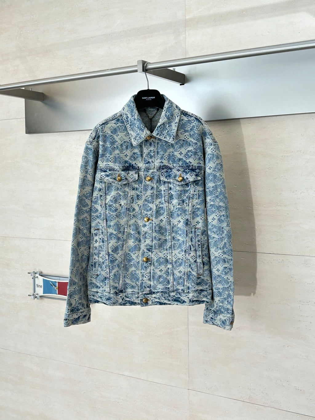 Blue denim jacket with allover monogram pattern, button front, pointed collar, long sleeves