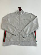 Grey Gucci zip-up jacket with side stripe details, front view