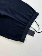 Dark navy monogram pants with side patch pocket and black drawstring cord