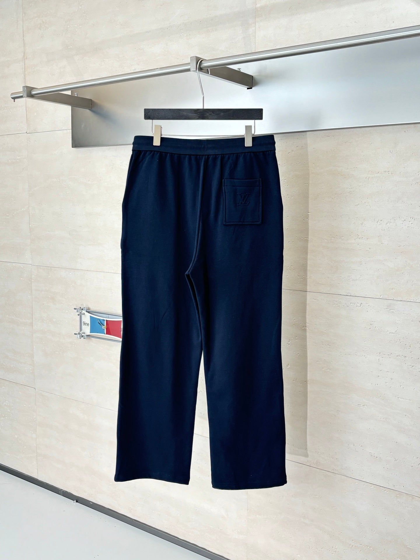 Dark navy drawstring pants with side pocket and patch detailing