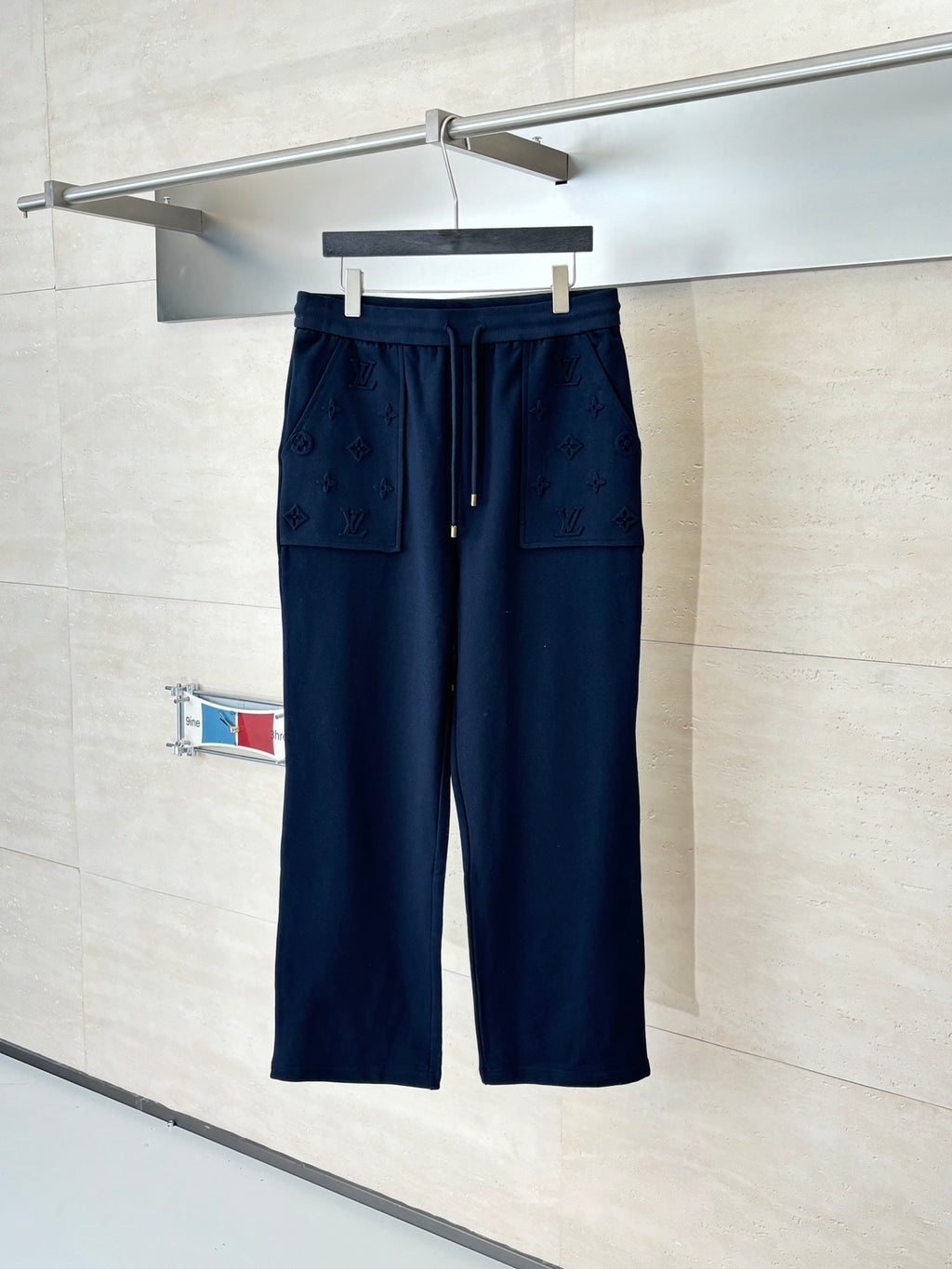 Dark navy monogram drawstring pants with front pockets