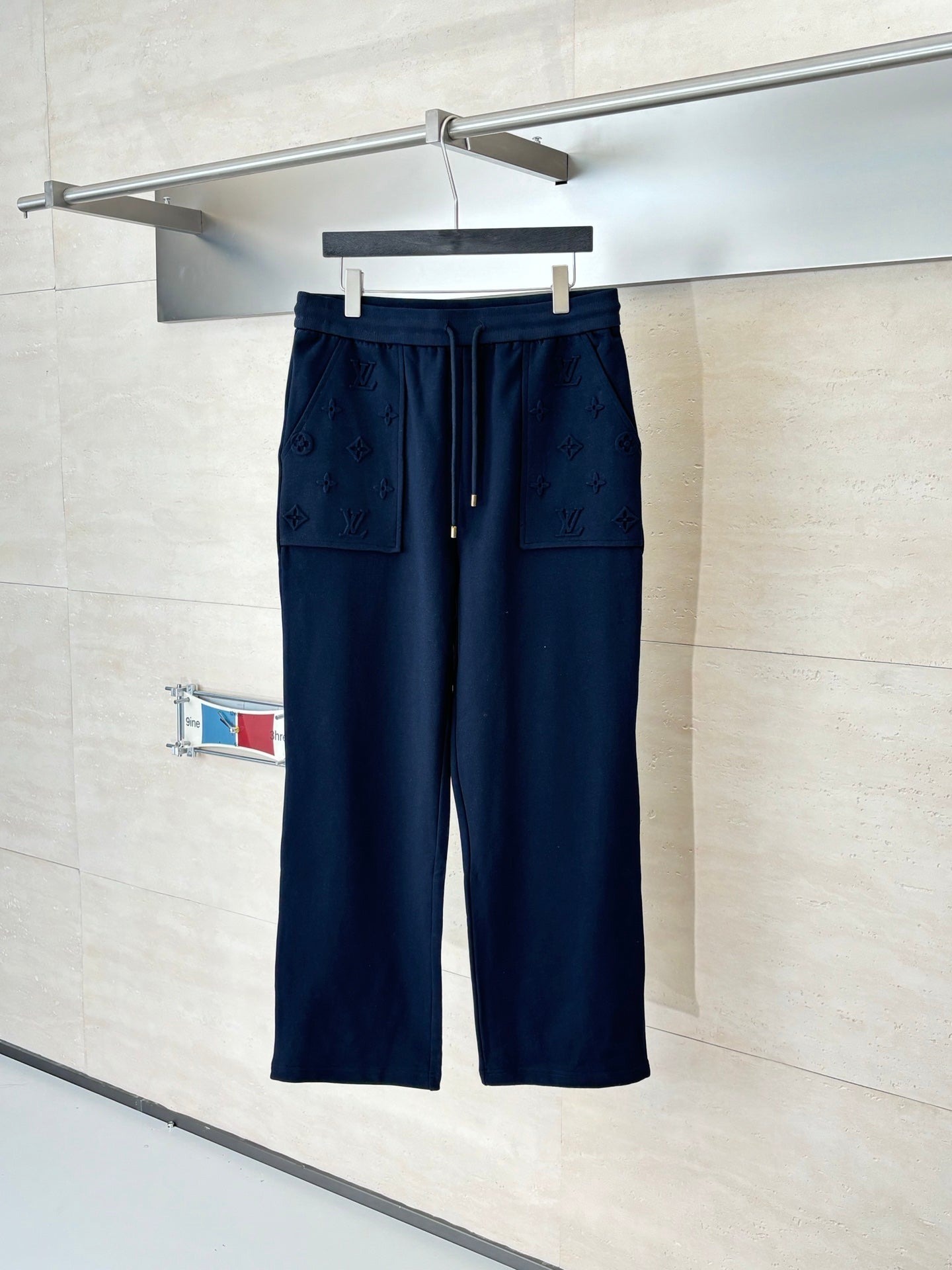 Dark navy monogram drawstring pants with front pockets
