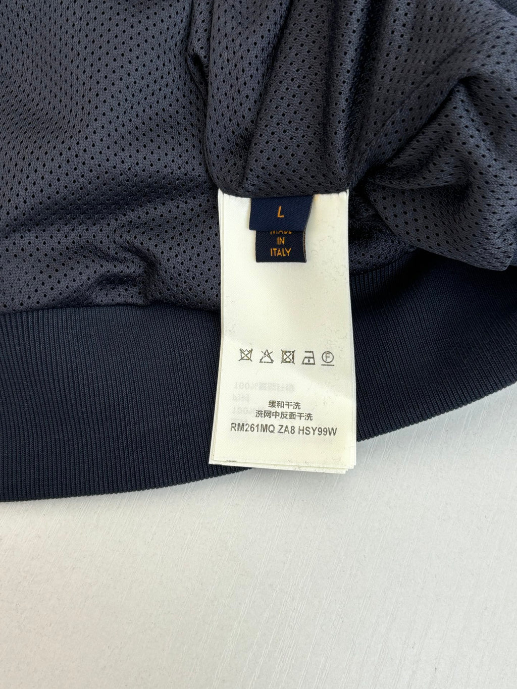 Louis Vuitton long-sleeve top with dark fabric and size label