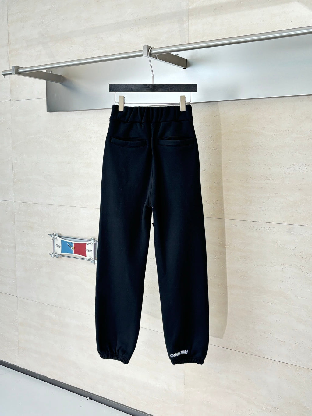 Black jogger pants with adjustable drawstring waistband and elastic cuffs