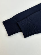 Navy knit sweater ribbed cuff and sleeve end detail