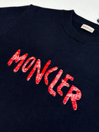 Navy sweater front with red MONCLER logo lettering