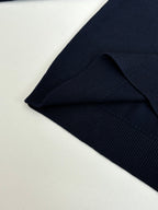 Navy sweater hem and ribbed cuff detail on long sleeves