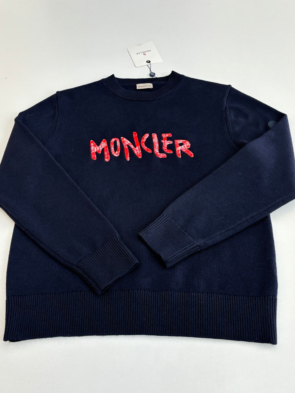 Navy crewneck knit sweater with red MONCLER logo on the front