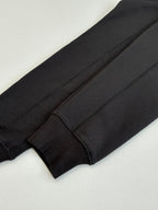 Dark sweatshirt sleeve cuff close-up with seam detail