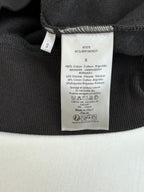 Dior long clothes with interior care label on dark fabric