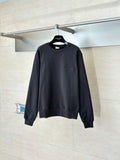 Dark long-sleeve sweatshirt with ribbed crew neck and cuffs