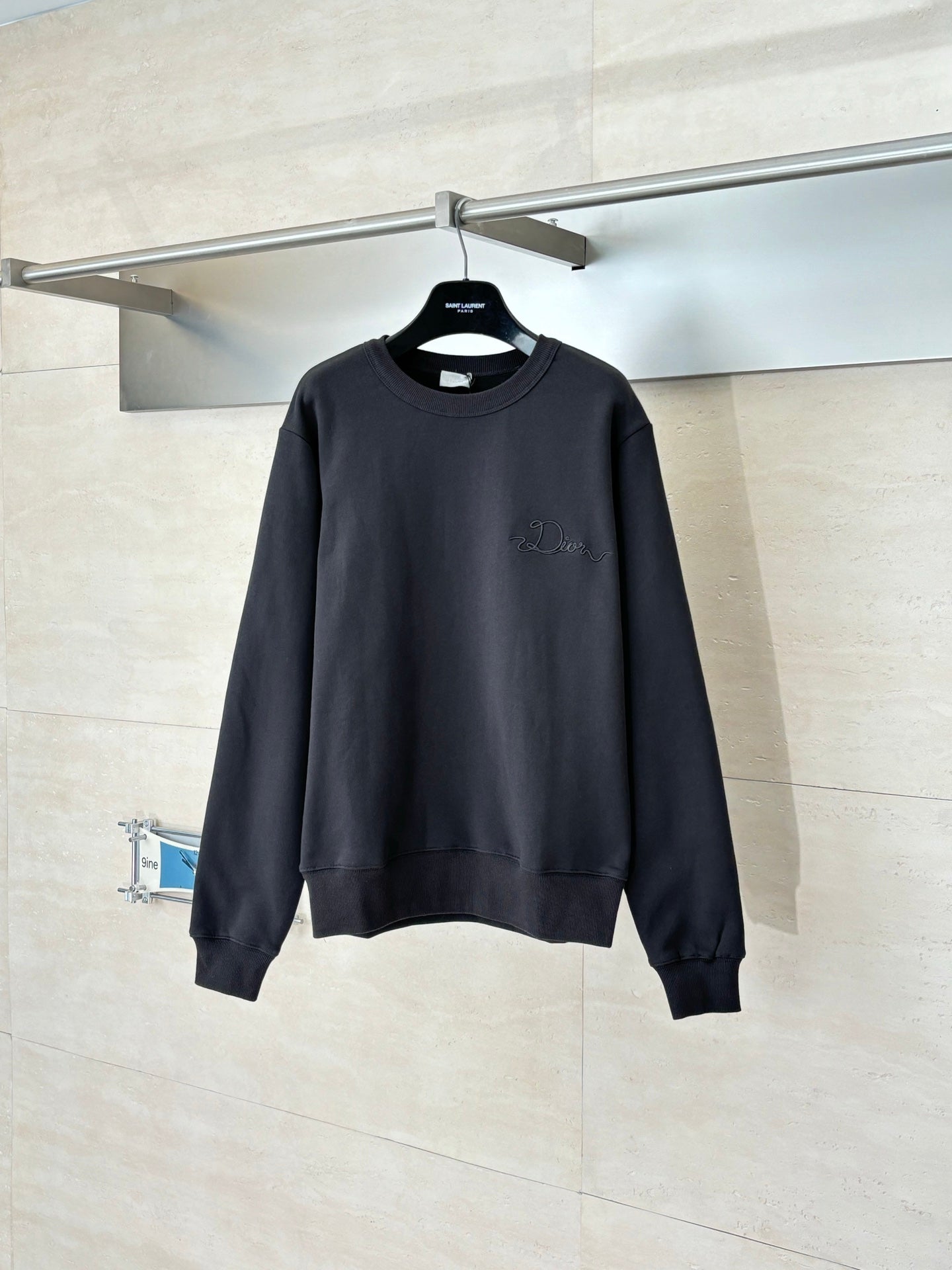 Dark long-sleeve sweatshirt with ribbed crew neck and cuffs