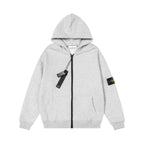 Zip-up hooded sweatshirt in heather gray with black zipper, drawcord, and sleeve patch