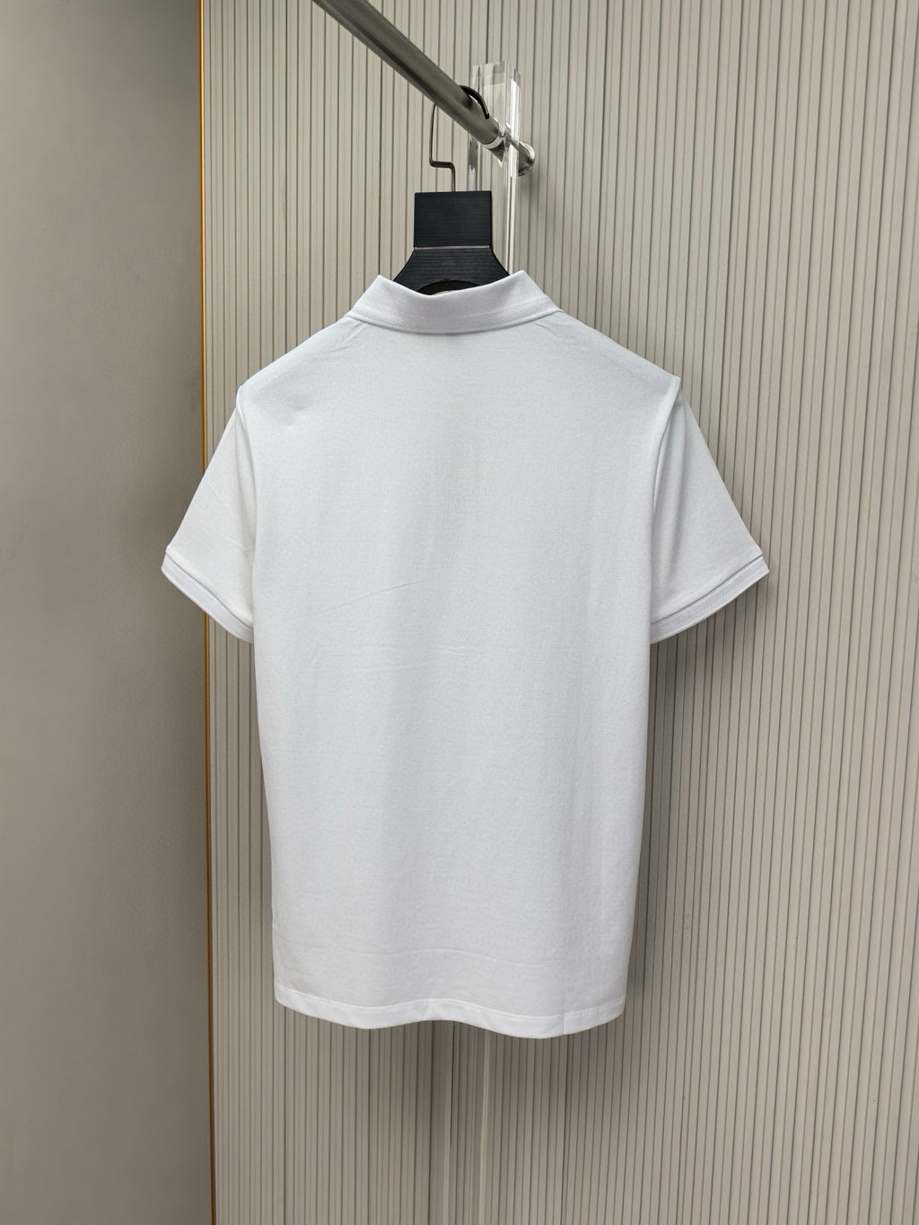 White polo shirt back view with ribbed collar