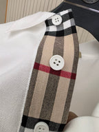 White polo shirt placket with Burberry tartan trim and white buttons