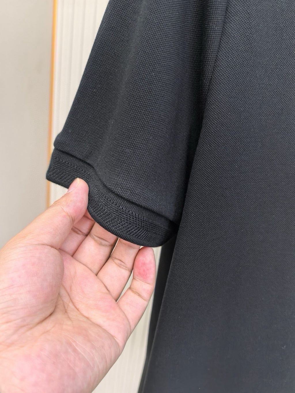 Burberry polo shirt sleeve cuff in dark navy with textured fabric