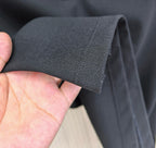 Burberry polo shirt sleeve hem seam detail on dark navy fabric