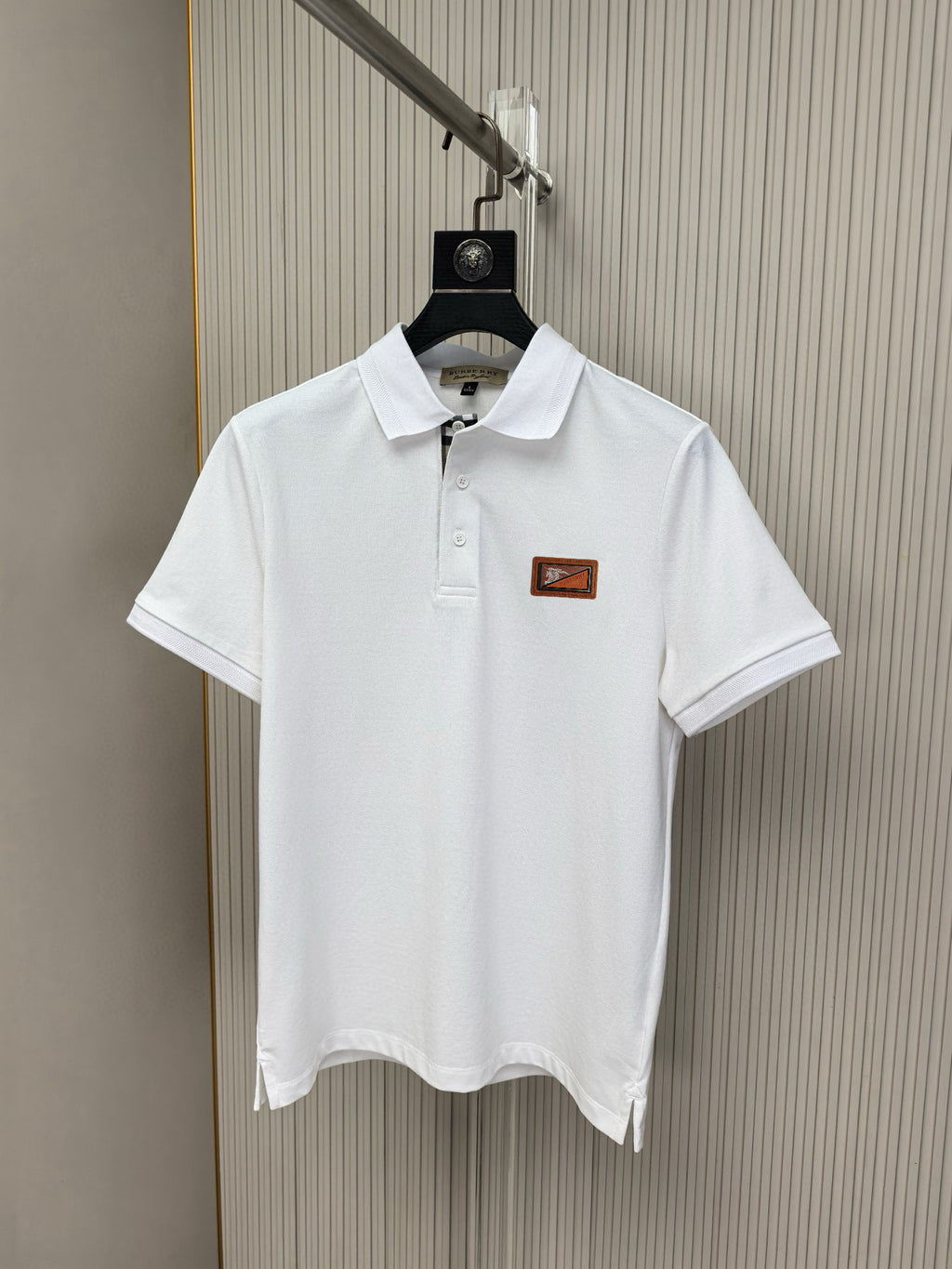 White Burberry polo shirt with button placket and chest logo patch