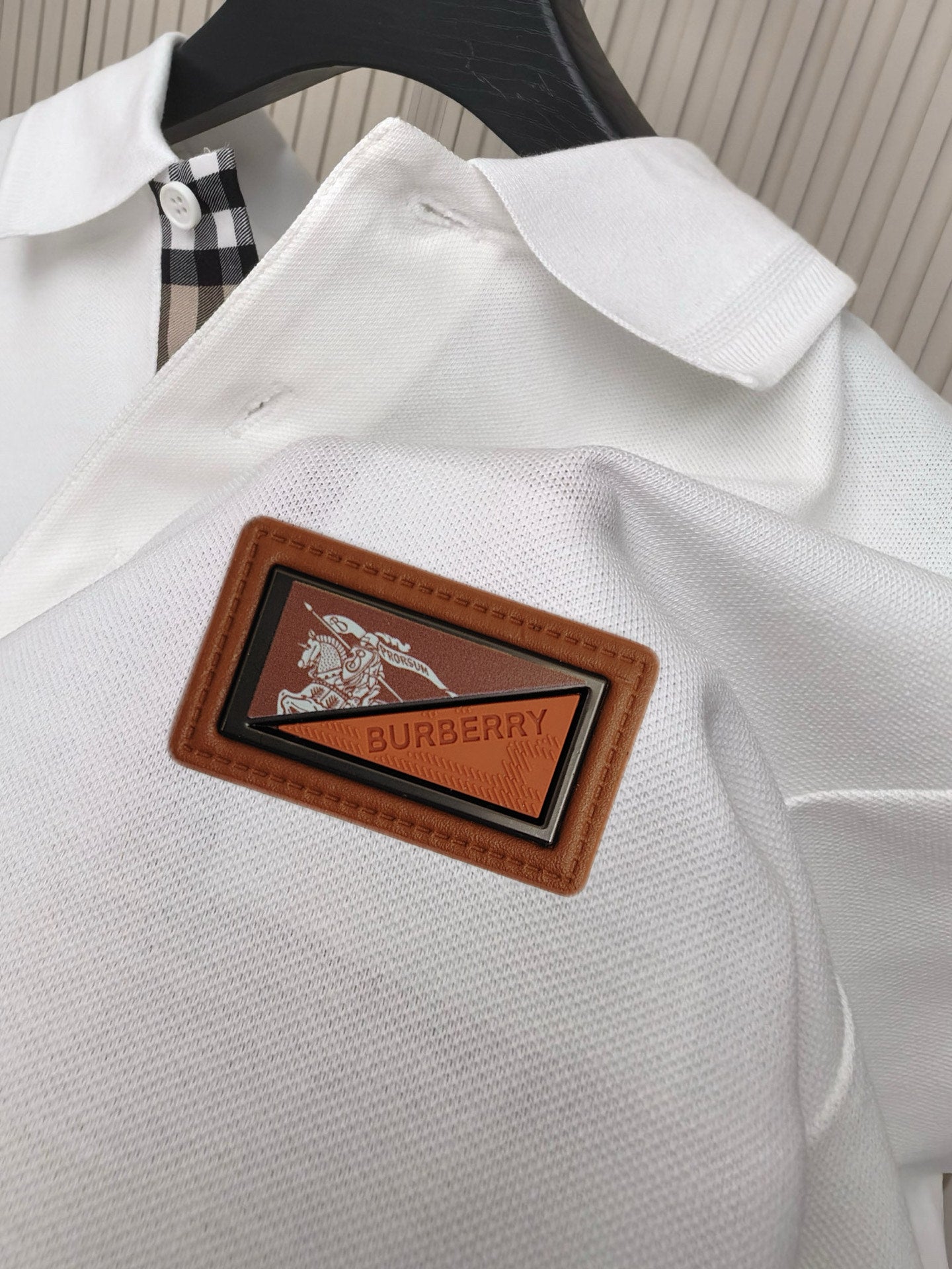 White polo shirt with Burberry woven leather logo patch