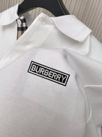 Burberry polo shirt back yoke with embroidered logo patch on textured fabric