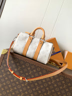 Louis Vuitton handbag with white monogram canvas, tan leather handles and crossbody strap