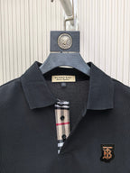 Dark polo shirt collar with button placket and Burberry crest patch