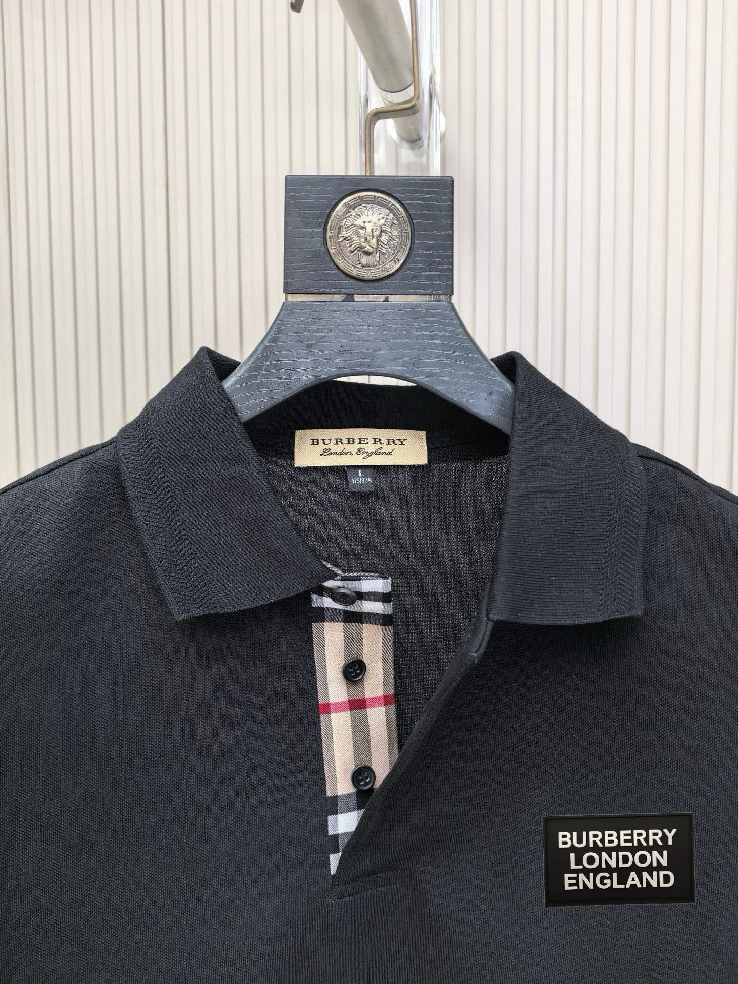 Burberry polo shirt collar and front placket with logo patch and buttons