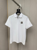 White polo shirt on hanger, buttoned collar and small chest logo patch