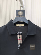 Burberry polo shirt, dark navy collar with check-trim placket and logo patch