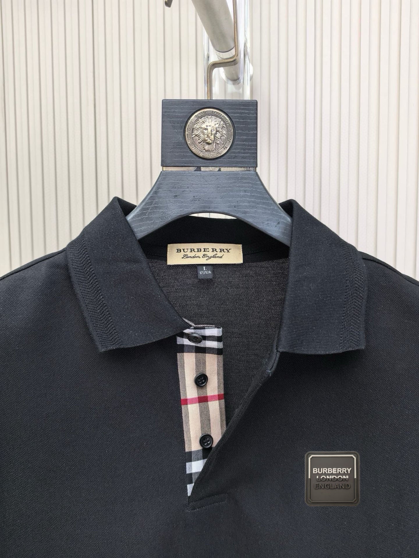 Burberry polo shirt, dark navy collar with check-trim placket and logo patch