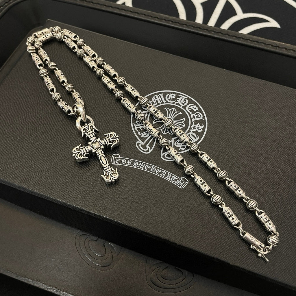 Silver-toned beaded chain cross pendant necklace set on black gift box