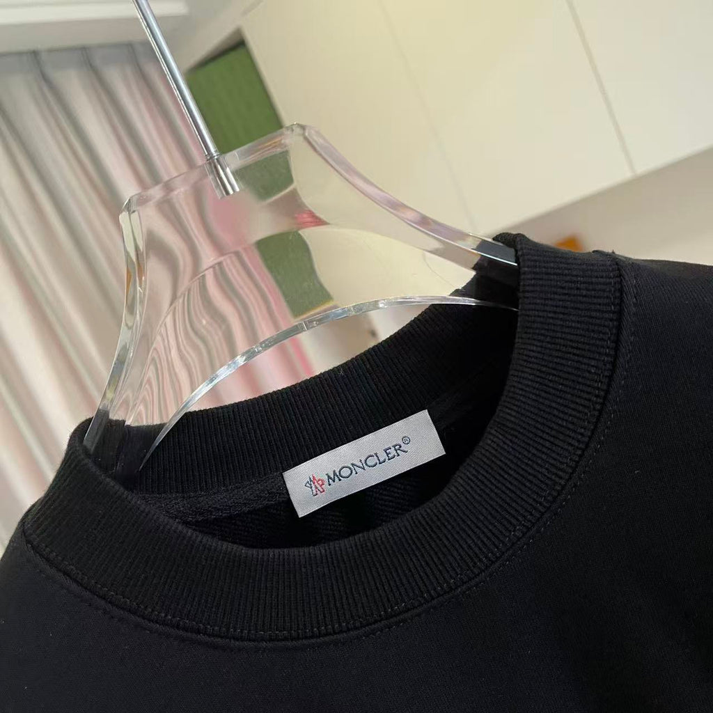 Black crewneck sweatshirt collar with Ribbed neckline and Moncler label inside neck