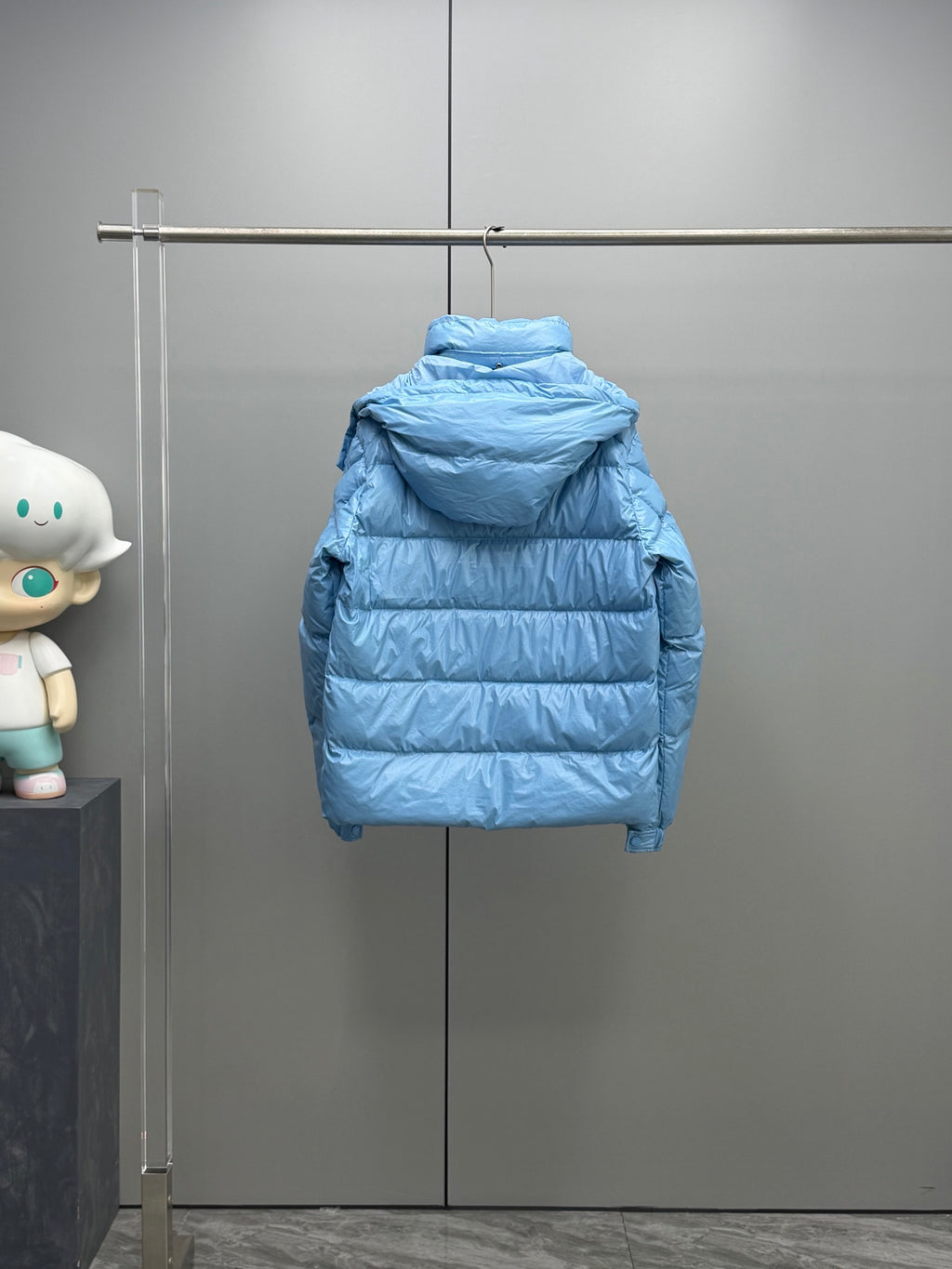 Moncler hooded puffer jacket, light blue, rear view with quilted stripes